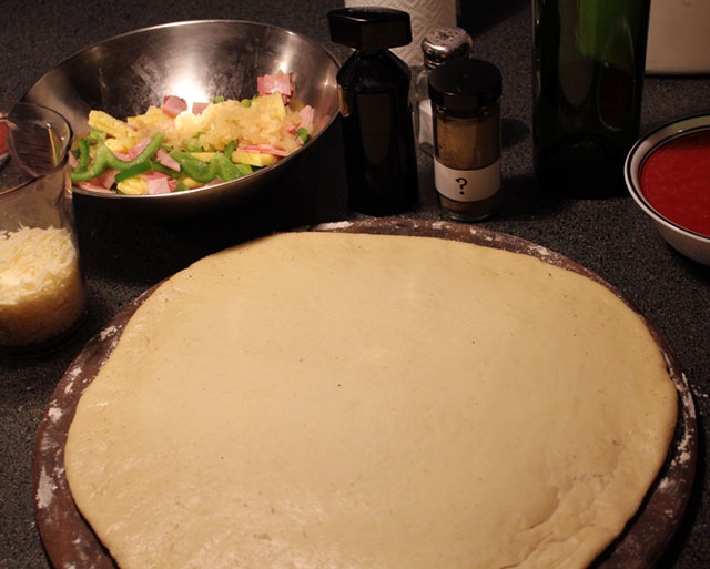 [image of pizza dough ready to be topped]