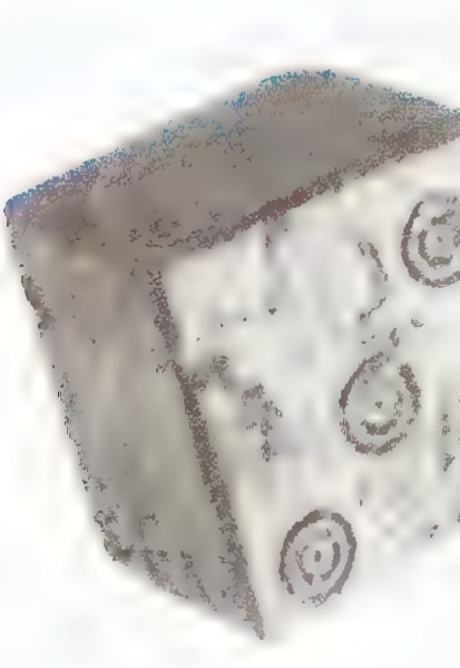 Photograph of a cube-shaped die made in Italy about 700 B.C., with circular marks on its faces.