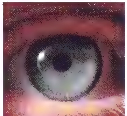Close-up photograph of a human eye, with the pupil and iris clearly visible.
