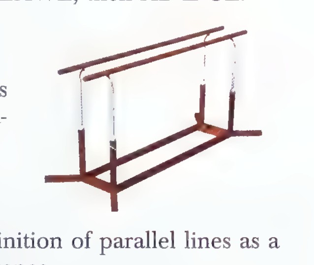 A photograph of a pair of wooden parallel bars in a gymnasium.
