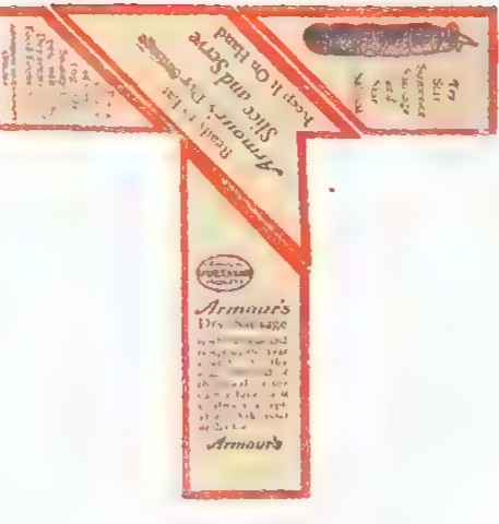 A T-shaped advertising card printed with an old label, marked with the two slanted cuts that divide it into four pieces.