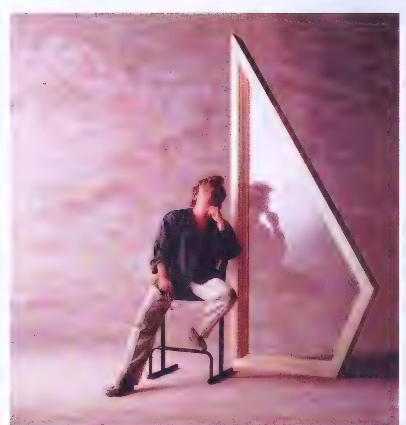 Photograph of a man seated on a bench beside an irregular window that has one right angle and four sides of different lengths.