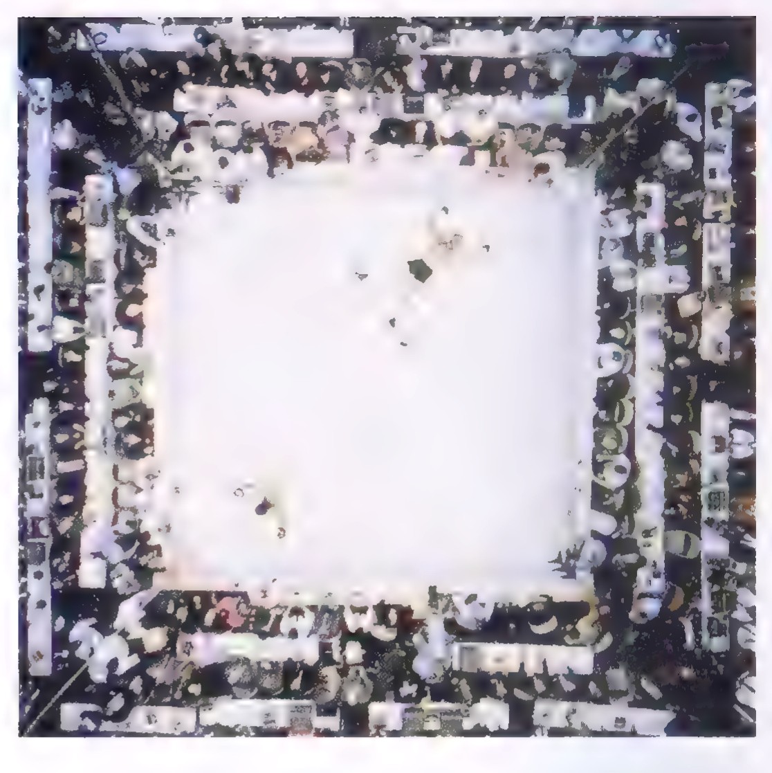 Photograph taken from directly above a boxing ring, with one boxer standing in the lower-left corner and another lying flat on the canvas.