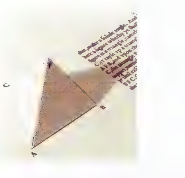 Photograph of a folded paper model of a tetrahedron, made from a triangle divided by its midsegments, still attached to a printed page.