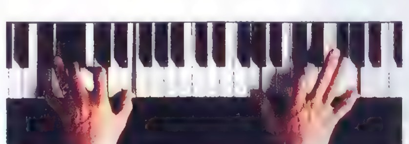 Photograph from above of two hands playing a piano keyboard, the keys repeating in the usual pattern of two and three black keys.