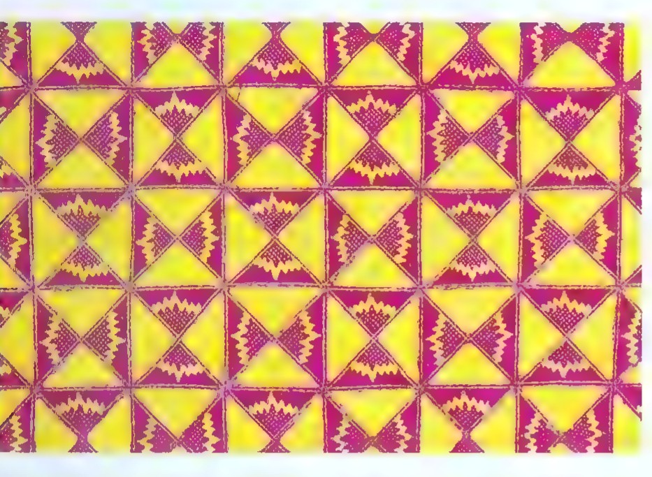 A batik fabric pattern of repeated yellow and maroon squares, each containing a right triangle with squares drawn on its sides.