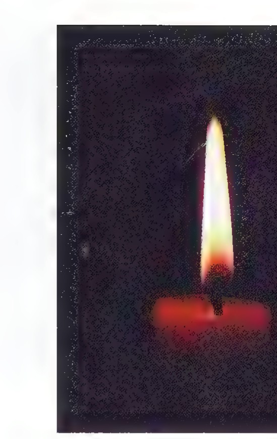 A photograph of a candle flame and its inverted image formed on a wall through a pinhole in a card.