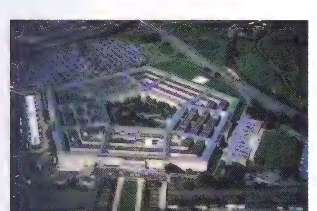 Aerial photograph of the Pentagon: a five-sided building with five concentric rings and a large central courtyard.