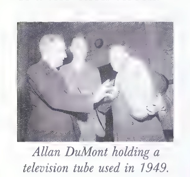 Photograph of Allan DuMont holding a television tube used in 1949.