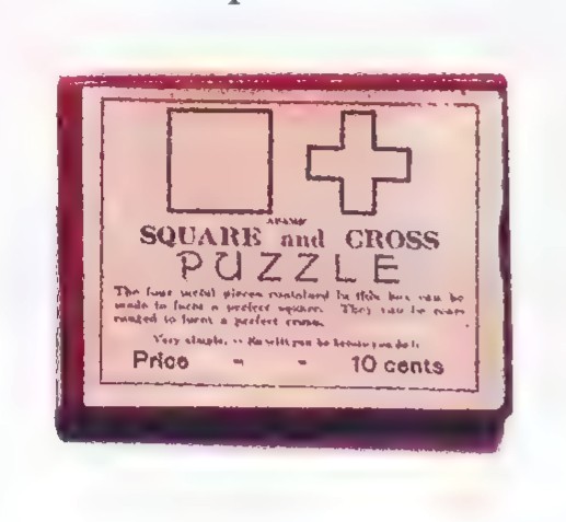 A small red box labeled “SQUARE and CROSS PUZZLE,” showing a square and a cross on its lid.
