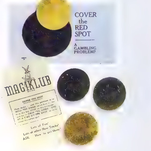 Photograph of the puzzle envelope, headed “Cover the Red Spot, A Gambling Problem?”, with four dark metal disks lying on and around it.