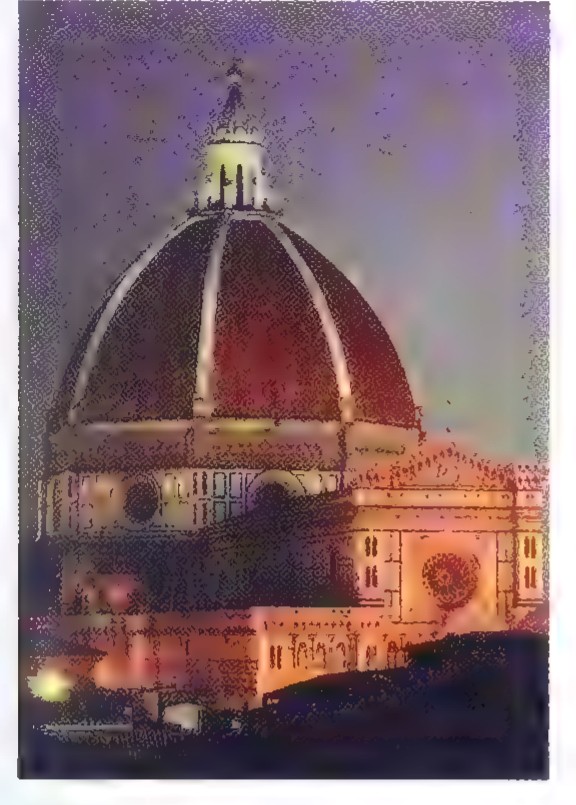 Night photograph of the dome of Santa Maria del Fiore in Florence, lit from below, with the lantern at its top against a purple sky.