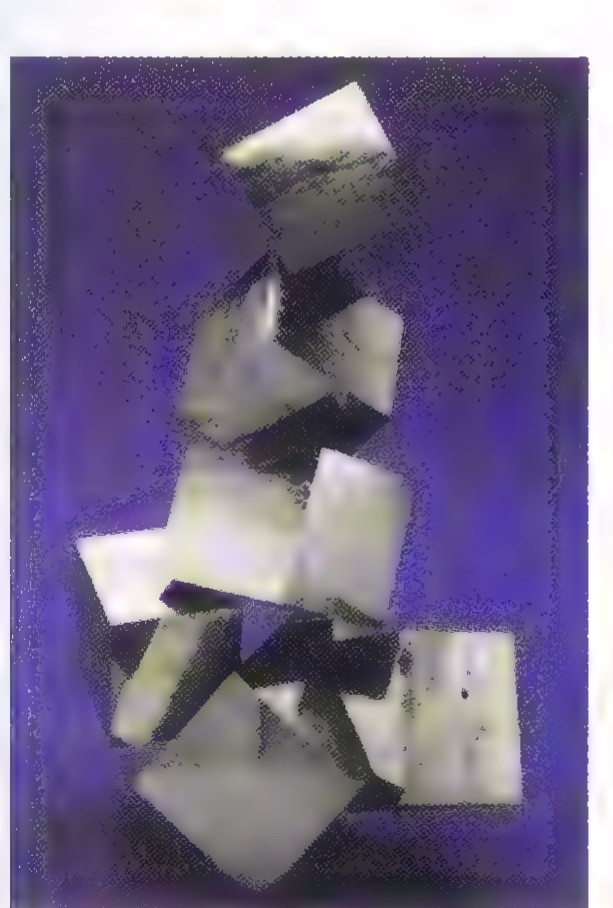 A cluster of pale, blocky pyrite crystals with square faces, photographed against a dark blue background.