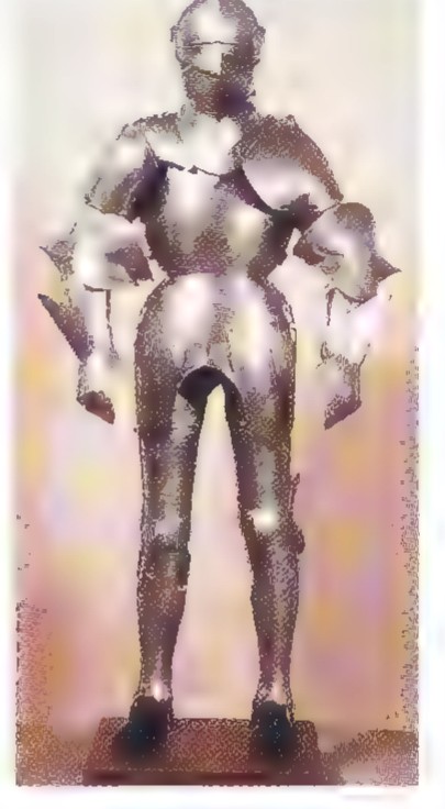 A suit of plate armor standing on a base, its rivets and fasteners visible.