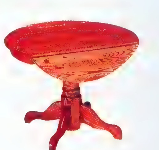A photograph of an antique drop-leaf table with a polished red-brown top and turned legs.