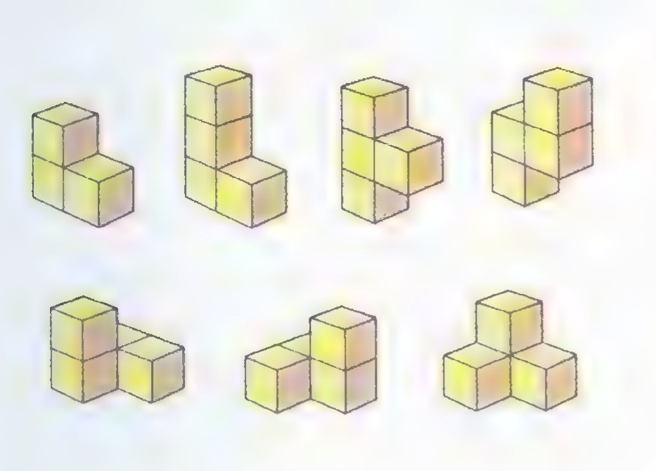 The seven Soma pieces, each made of three or four small cubes glued together, arranged in two rows.