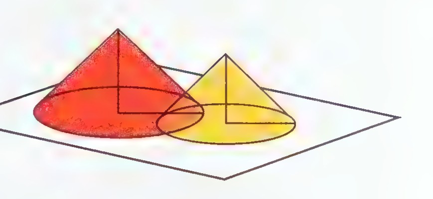 Two cones of light, red and yellow, falling on a stage from above.