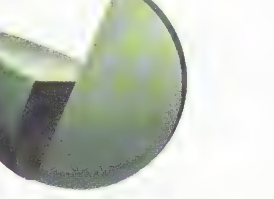 Photograph of a dark green stone sculpture shaped as a hemisphere cut by two vertical planes.