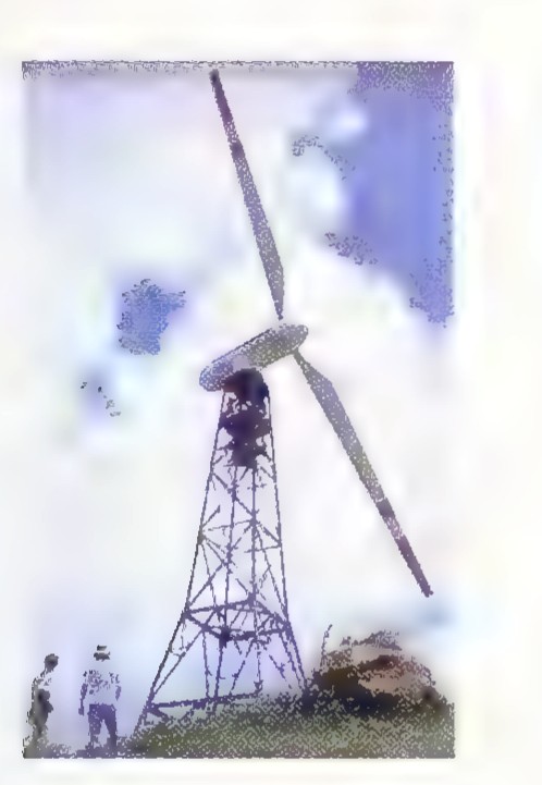 Photograph of a tall NASA windmill with two long blades, with two people standing at its base for scale.