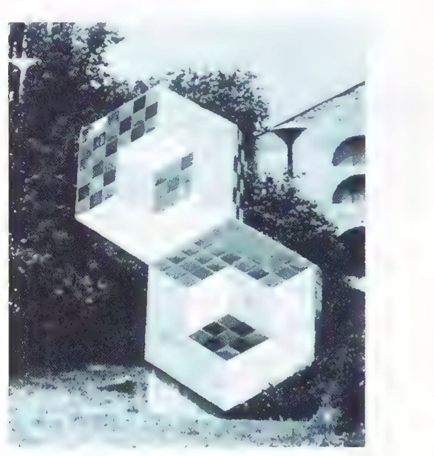 Photograph of a large white sculpture made of interlocking cubes with checkerboard-patterned faces.