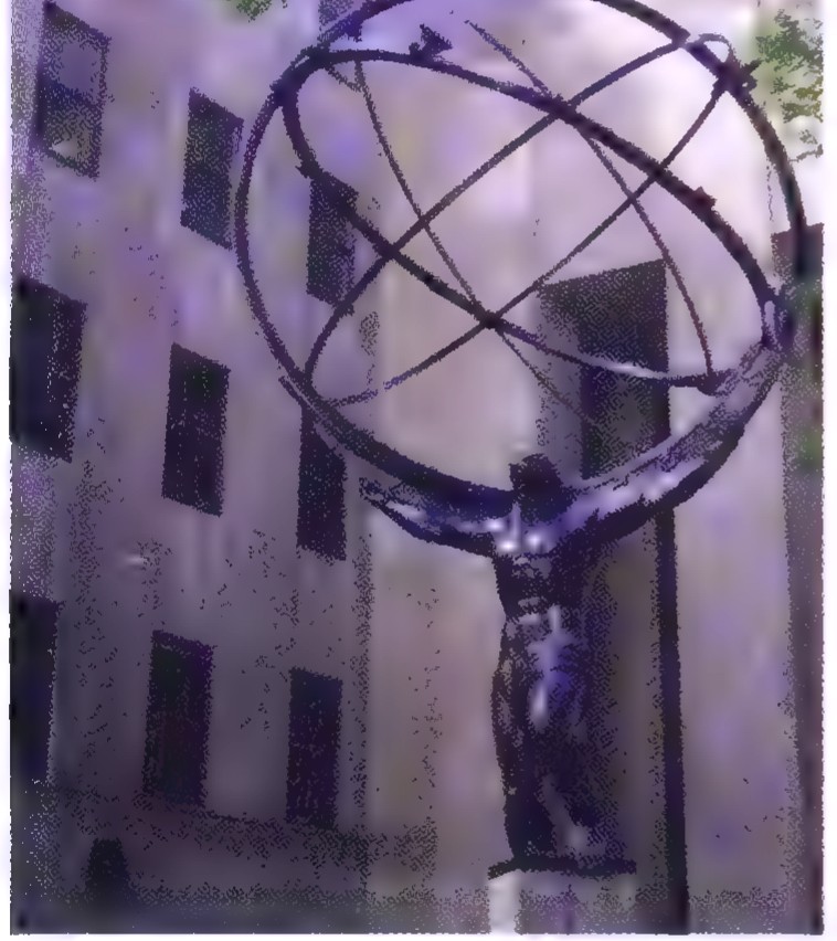 Photograph of the Atlas statue at Rockefeller Center, holding a globe marked with great circles.